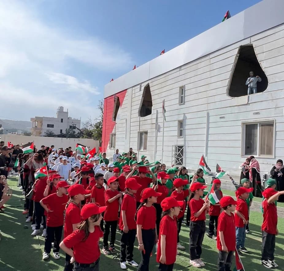 Lulu'at AlElm Schools students during a Flag Day activity