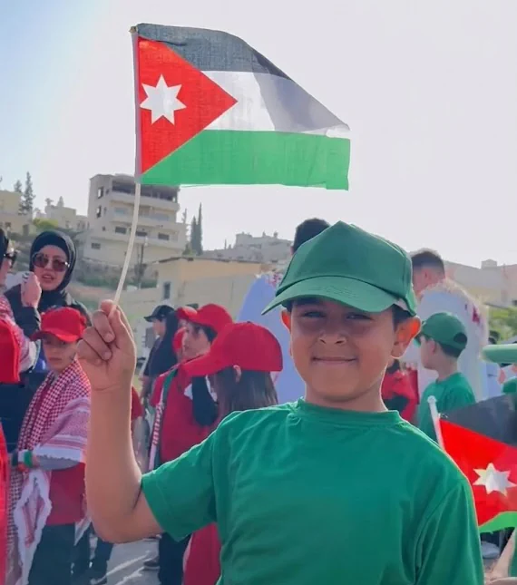 Lulu'at AlElm Schools student in a Flag Day activity