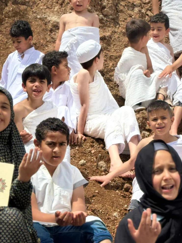Students in an outdoor part of the Hajj activity