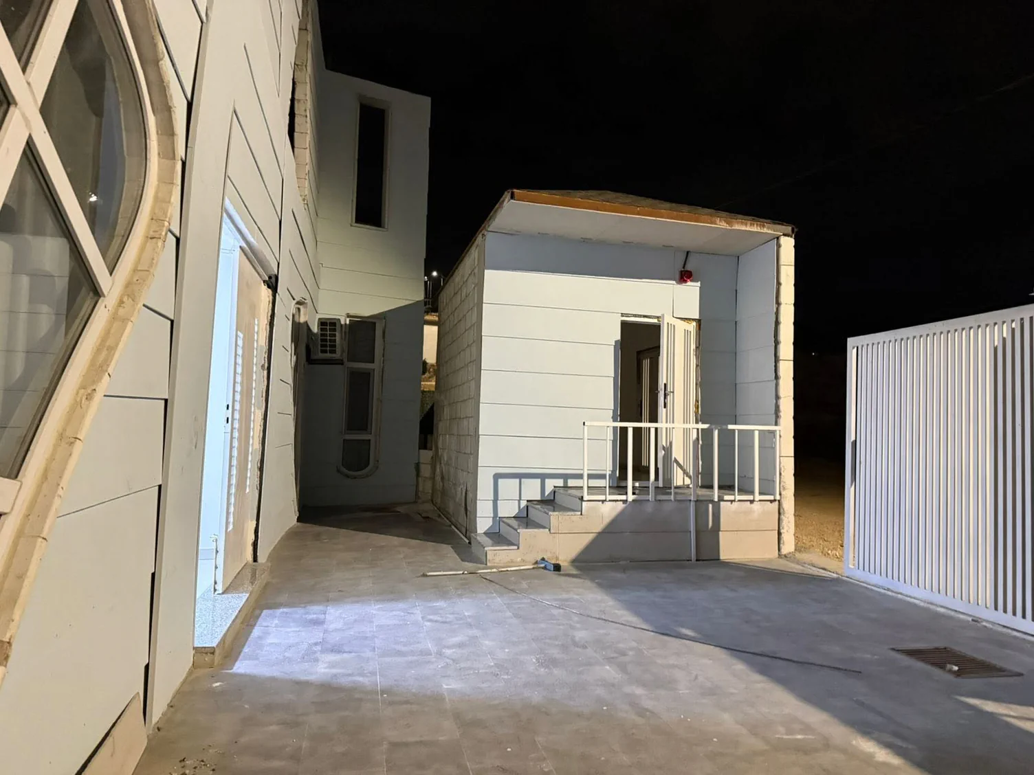 Night courtyard at Lulu'at AlElm Schools