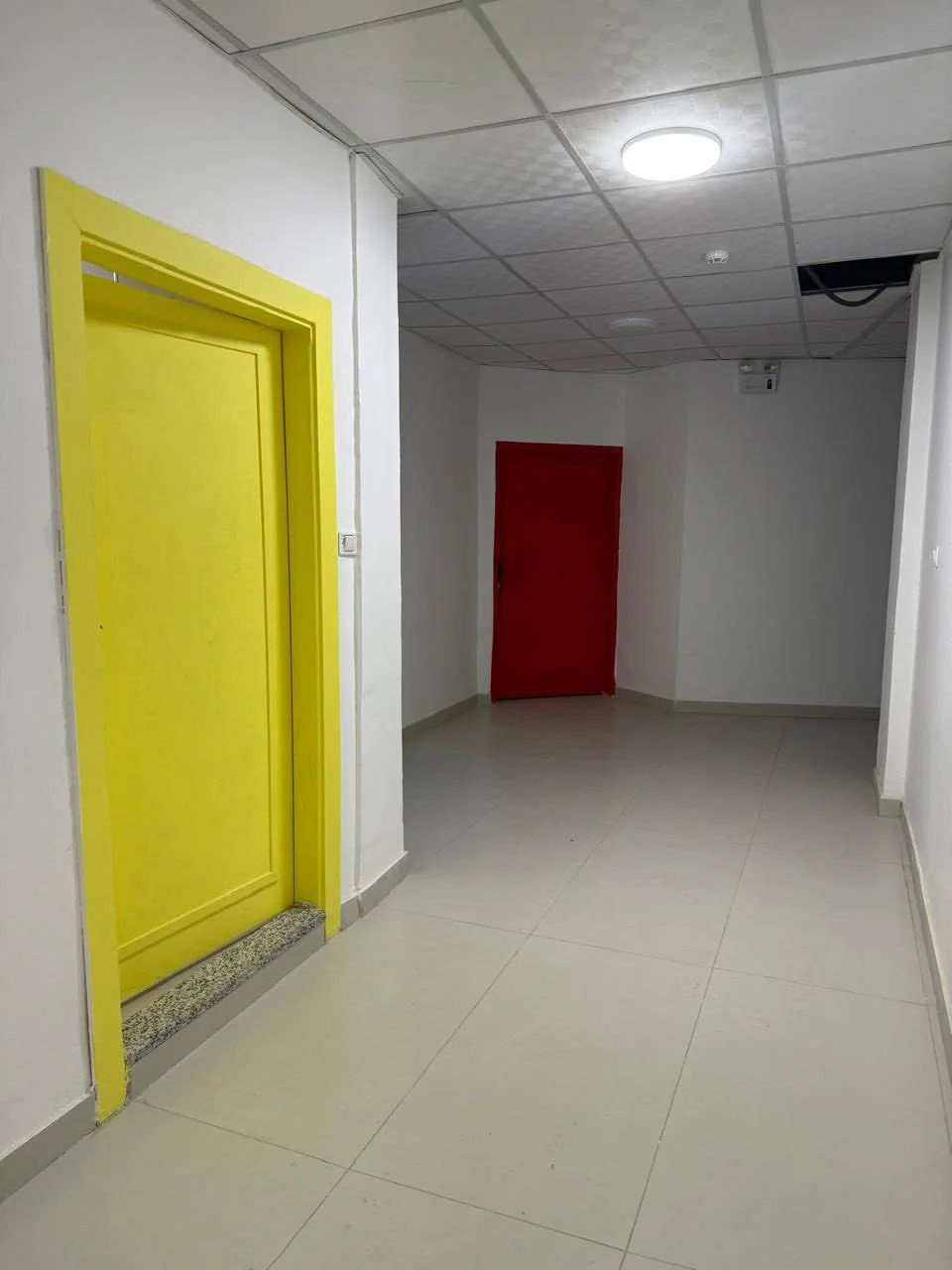 Hallway with classroom doors at Lulu'at AlElm Schools